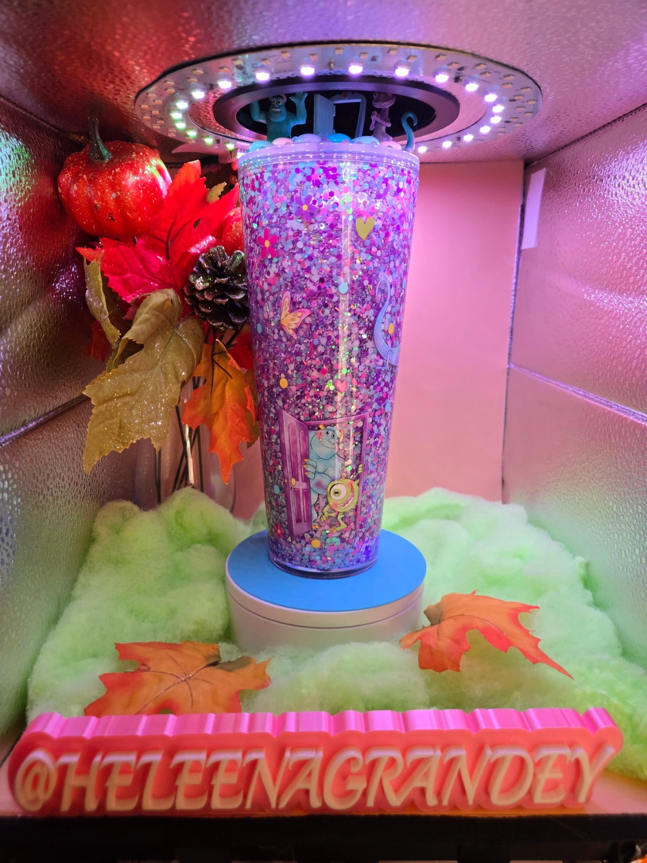 cup with pink glitter with butterflys and monsters inc