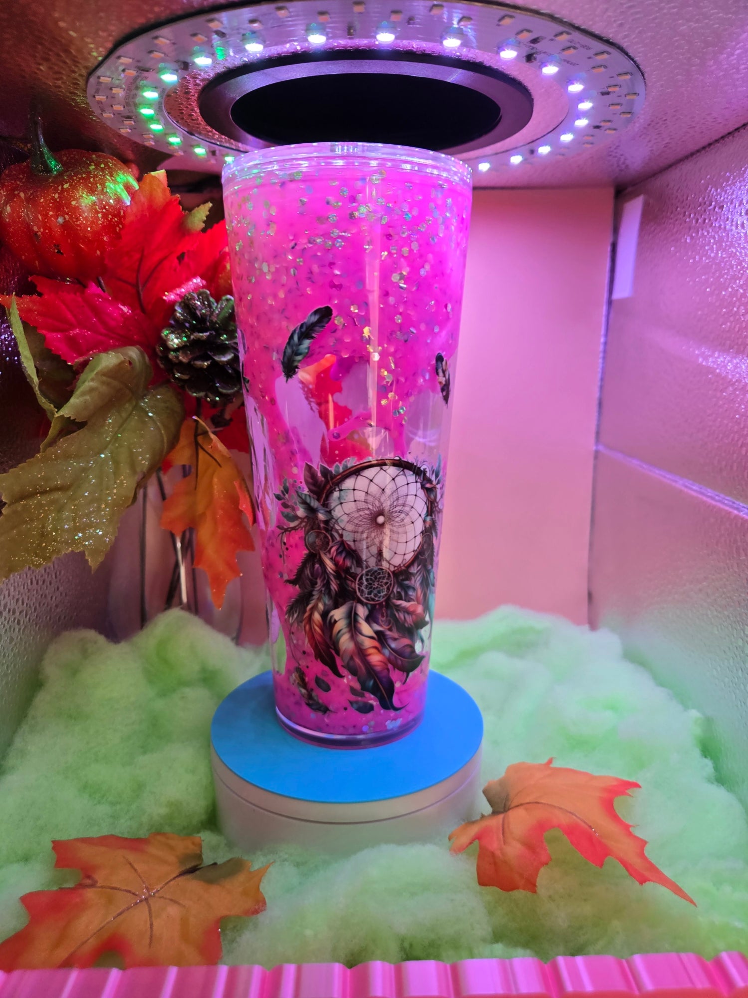 pink filled cup with dream catcher