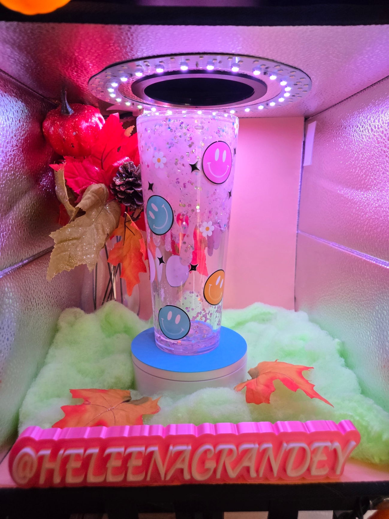 lite pink filled cup with smiley faces