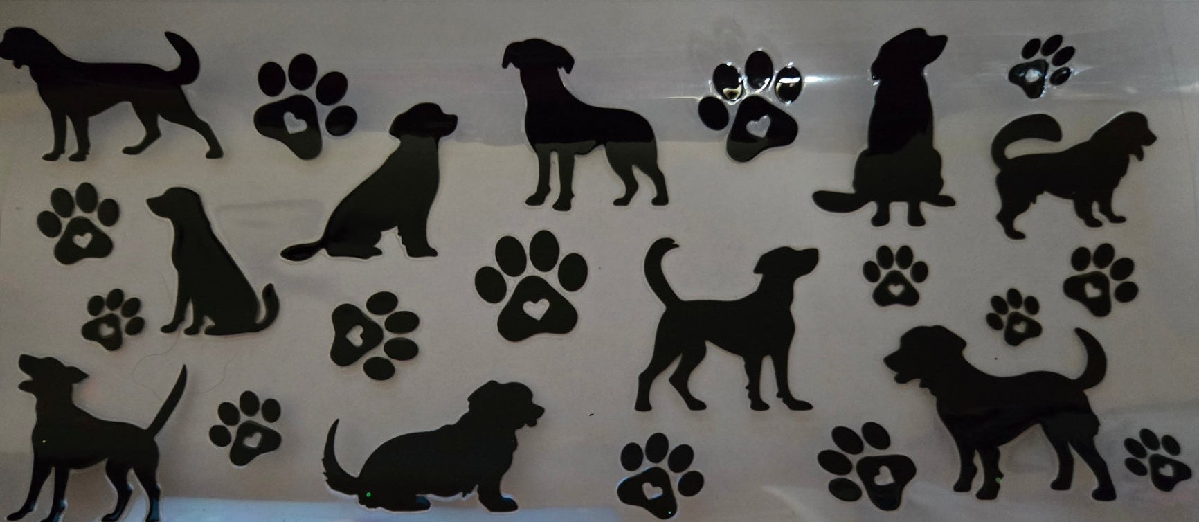dog silhouettes with paw prints